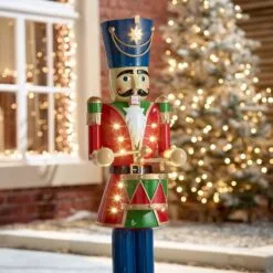 Norbert The 3ft Red Christmas Nutcracker With Drum 19 Norbert The 3ft Red Christmas Nutcracker With Drum -Twinkly Shop w18523 outdoor lifestyle shot 4