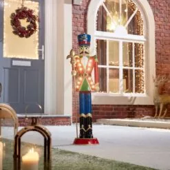 Norbert The 3ft Christmas Nutcracker With Staff 27 Norbert The 3ft Christmas Nutcracker With Staff -Twinkly Shop w18524 outdoor lifestyle shot 1