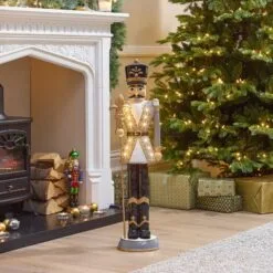 Norbert The 3ft Christmas Nutcracker With Staff 40 Norbert The 3ft Christmas Nutcracker With Staff -Twinkly Shop w18526 indoor lifestyle shot 2